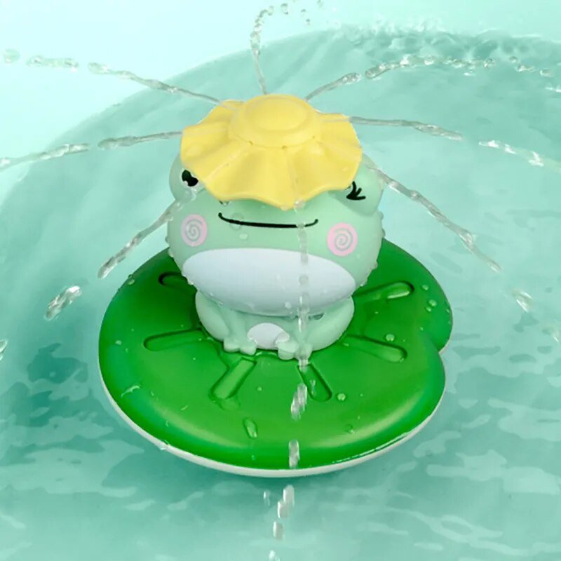Electric spray water frog bath toy with a yellow shell floating on a lily pad in the tub.