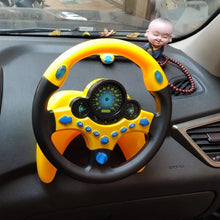 Electric simulated steering wheel toy mounted on a car dashboard for backseat pretend driving.