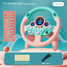 Cherry blossom pink and teal steering wheel toy on a U-shaped base with three nano paste pieces and one magic tape shown below