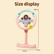 Pink steering wheel toy on a stand with size markers of 48 cm tall and a 25 by 16 cm base