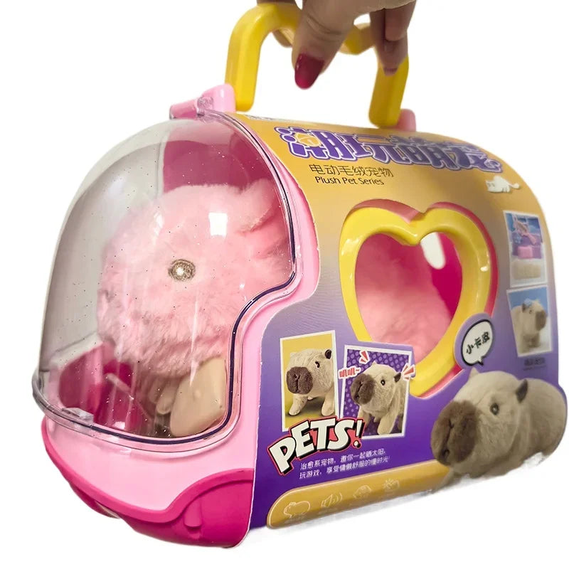 Pink carrier box with a clear dome and a pink capybara plush toy inside, held by a yellow handle