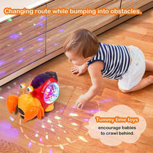 Electronic crawling crab glowing music toy used during tummy time for developmental play.