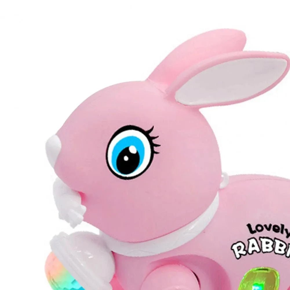 Electronic walking rabbit toy in pink with a large blue eye for engaging baby play.