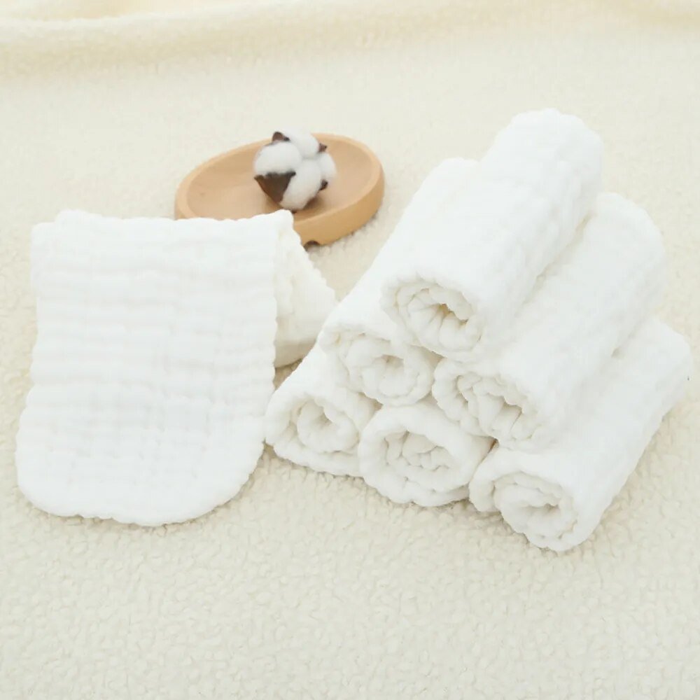 Elinfant cotton diaper inserts laid on a beige surface for daily cloth diapering use.