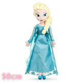 Toy doll in a blue dress with long blonde hair.