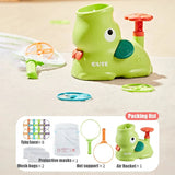 Green toy with cartoon face on a beige surface, accompanied by a packing list of accessories.