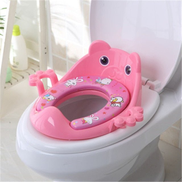 Pink cartoon toilet seat on a white toilet