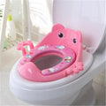 Pink cartoon toilet seat on a white toilet