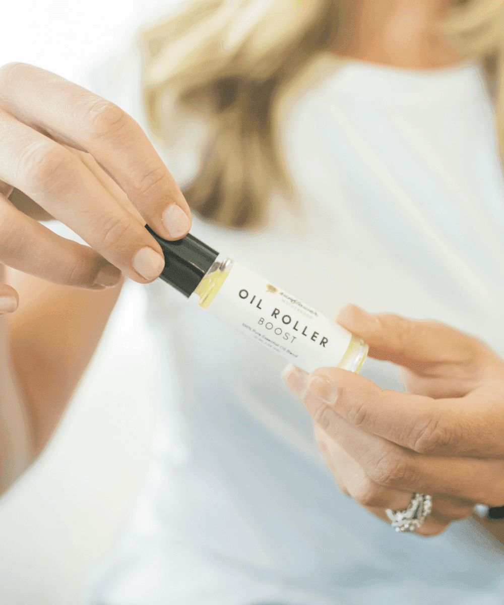 Person holding an oil roller.