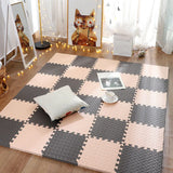 Checkered foam puzzle mat on a wooden floor with decorative elements.