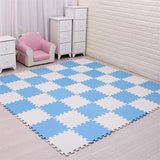 Blue and white checkered foam mats on a floor with a pink chair and white furniture.