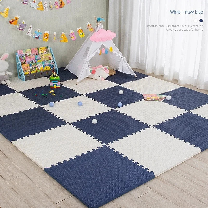 Children's play area with a navy and white foam mat, toys, and a small tent.