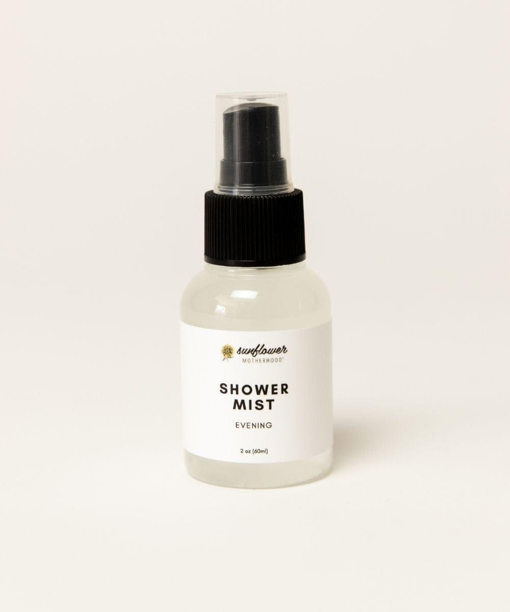 Bottle of shower mist labeled 'Sunflower'.