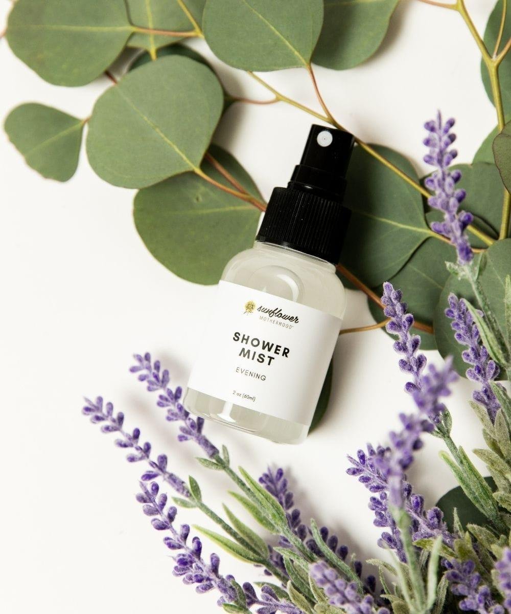 Shower mist bottle with lavender and eucalyptus leaves.