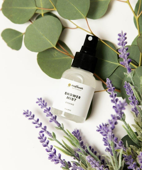 Shower mist bottle with lavender and eucalyptus leaves.
