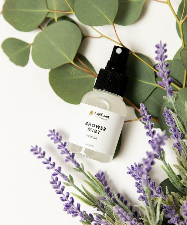 Shower mist bottle with lavender and eucalyptus leaves.
