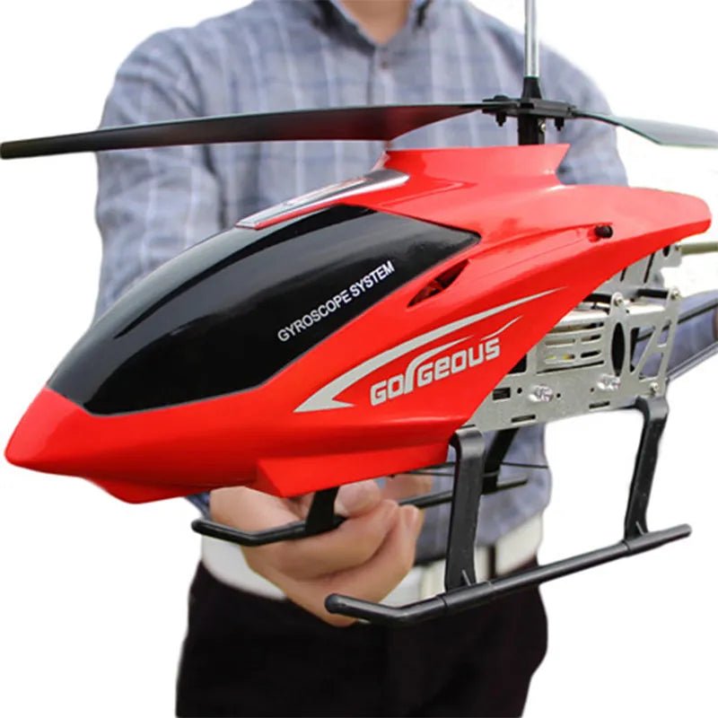 Red and black toy helicopter with 'Gorgeous' branding held by a person.