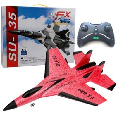 Red and black remote control airplane with packaging and controller on a white background