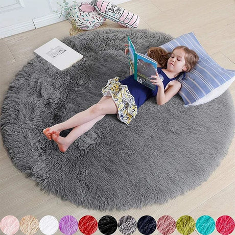 Child reading a book on a large gray fluffy rug with color swatches below.