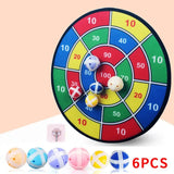 Colorful dartboard game with darts on a beige background