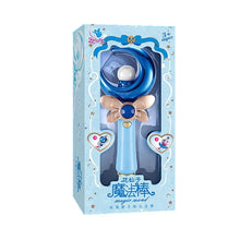 Blue window box holding a wand with a blue crescent moon and a bow