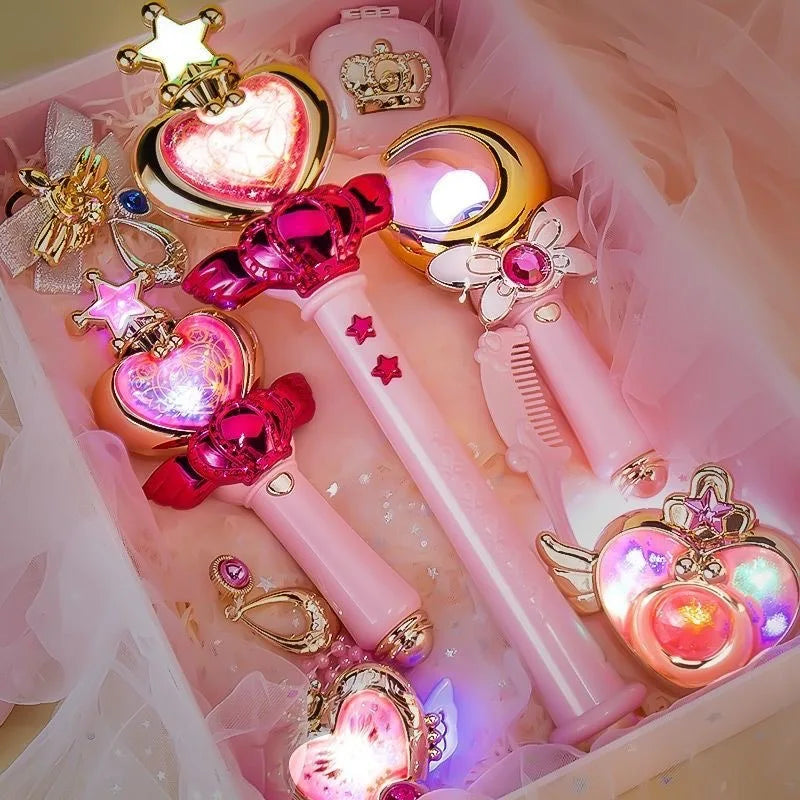 Glowing heart, moon and star-shaped magic wands with colorful lights lying in a pink gift box