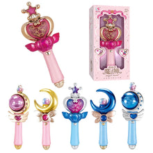 Pink heart-crown wand beside its pink box above a row of five pink, gold and blue wands