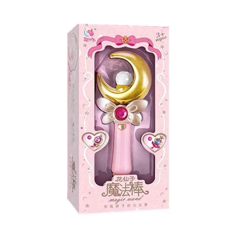 Pink window box holding a wand with a gold crescent moon and a red gem