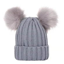 Gray knit beanie with two fluffy pom-poms