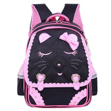 Black and pink backpack with cat face design.
