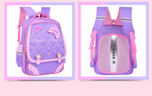 Two purple school bags with pink accents 