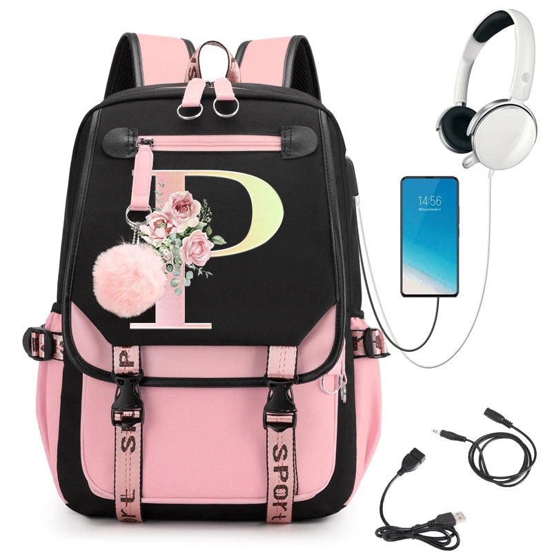 Pink and black backpack with floral design, phone, headphones, and USB cable.