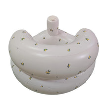 Floral-print inflatable baby seat with built-in air pump for quick setup and play.