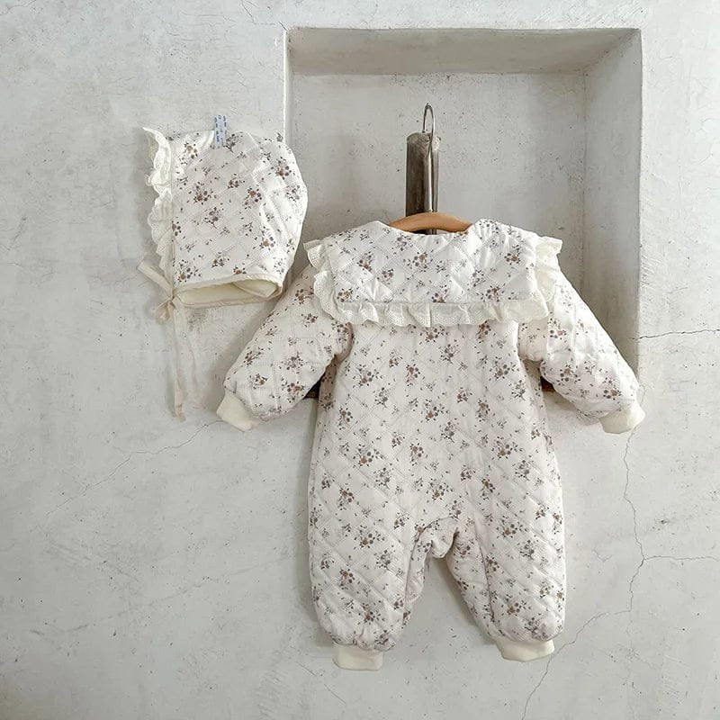 Floral winter romper with matching fur-lined hat, a two-piece toddler outfit for chilly mornings and outdoor playtime.