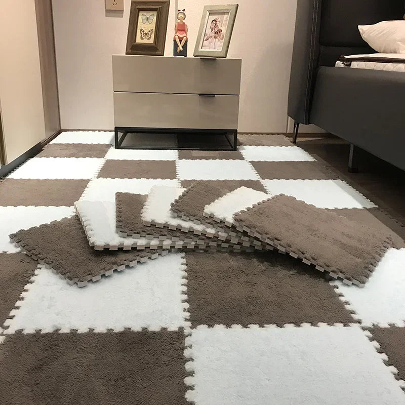 Checkered foam puzzle mat in gray and white.