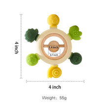 Forest Teether ring rattle in green and yellow for two-handed holding and comfortable teething soothing.