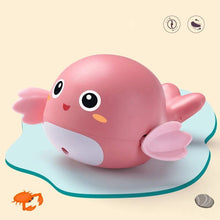 Frogs Clockwork Swimming Bath Toy in pink design with a smiling face shown again for bathtub play.