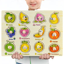 Child holding a Montessori wooden fruit puzzle with names for shape matching and sorting practice.