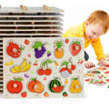 Montessori wooden fruit and vegetable puzzle for toddlers exploring shapes and colors through hands-on play.