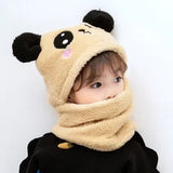 Child wearing a beige bear-themed hood and scarf.