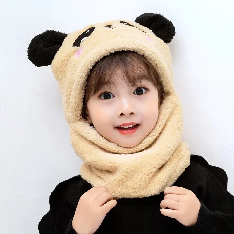 Child wearing a beige hood with panda ears 