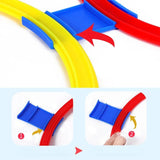 Colorful plastic track pieces with assembly instructions.