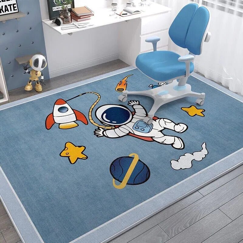 Children's room with a blue rug featuring space-themed designs, a blue chair, and toys.