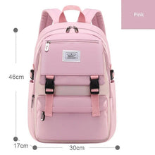 Capacity layout view of the pink waterproof girls backpack, with room for textbooks, a laptop, and everyday school essentials.