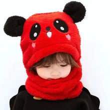 Child wearing a red panda-themed hat and scarf 