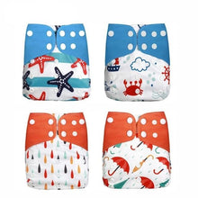 Four colorful baby diapers with sea-themed prints 