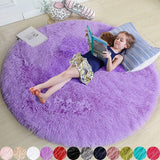 Child lying on a large purple round rug reading a book, with color swatches at the bottom.