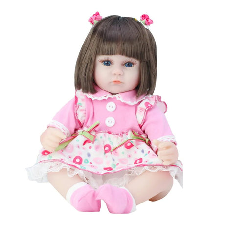 Doll with brown hair and a pink outfit on a white background
