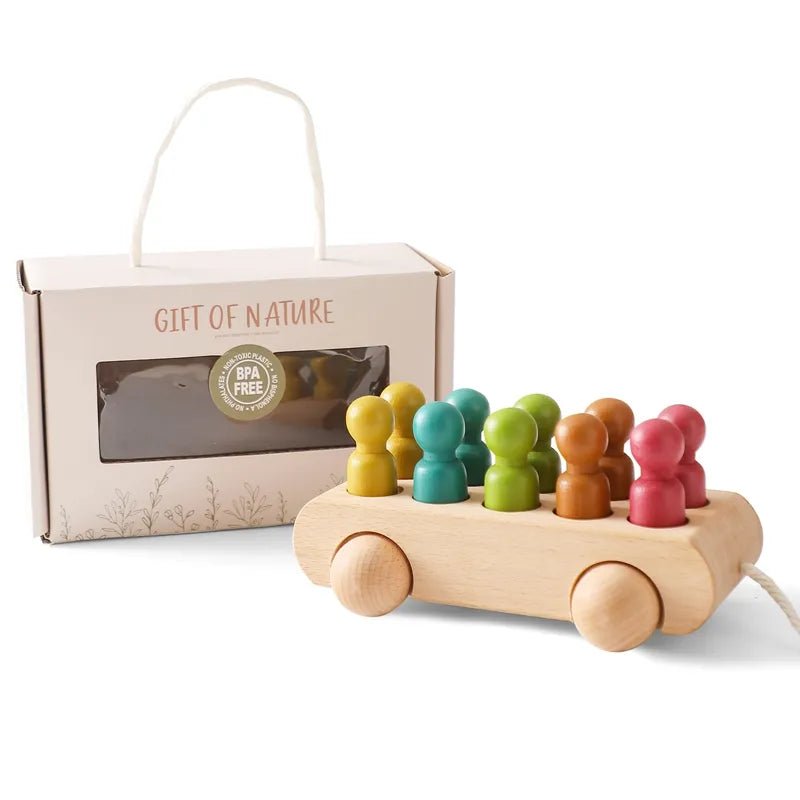 Montessori wooden train and trolley fine motor toy with colorful pegs in Gift of Nature branded packaging.
