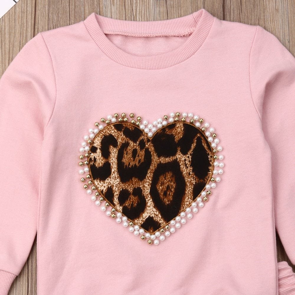 Girls pink leopard heart sweatshirt with pearl trim for warm everyday layering in cooler months.